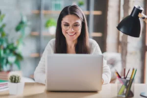 -woman-wearing-a-headset-sitting-behind-a-computer-screen